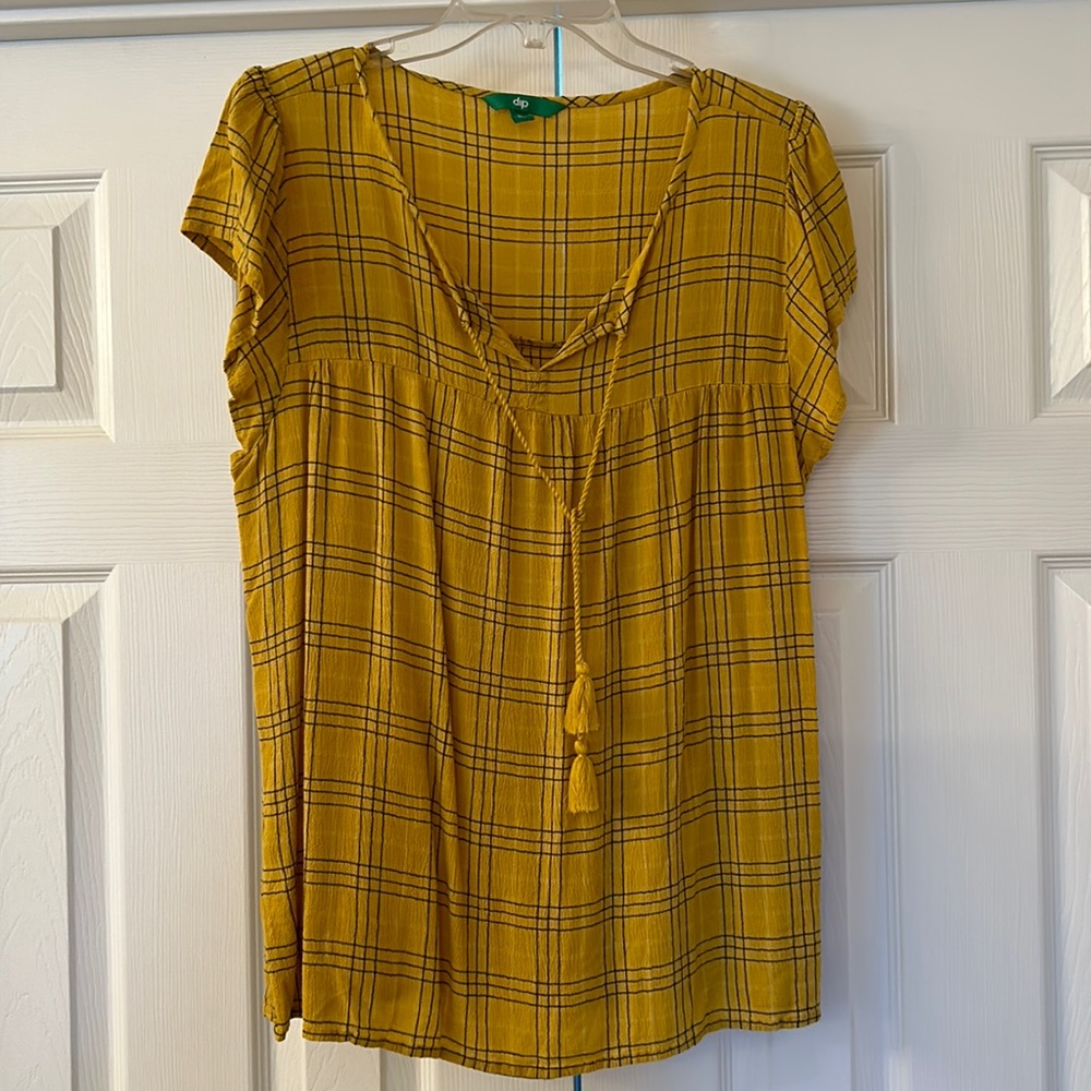 Peasant style top with tassel tie.